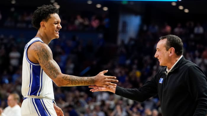 Paolo Banchero high fives Coach K